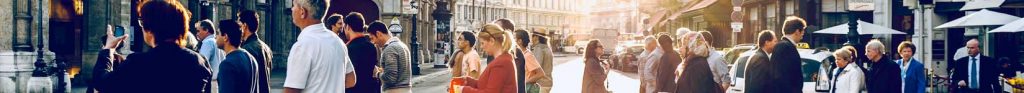 various people crossing street